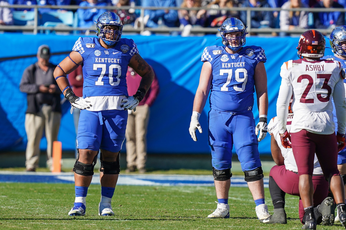 A versatile lineman, Darian Kinnard (left) has the size and strength to be a difference-maker in the NFL. 